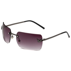 Frameless Y2K sunglasses with butterfly diamond accents and gradient purple lenses