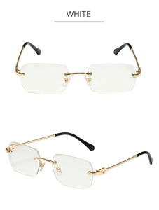 Macro detail of rimless rectangle sunglasses featuring gold metal bridge and textured arms