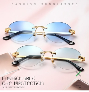 Detail of rimless metal sunglasses featuring iconic leopard head hinge decoration