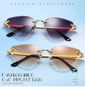 Detail of rimless leopard head sunglasses with gradient lenses and gold wavy metal temples