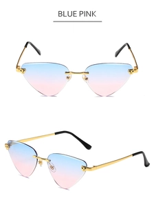 Detail of rimless blue and pink gradient sunglasses with golden metal wavy temples
