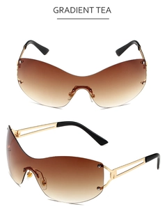 Close-up of semi-rimless square sunglasses featuring gradient tea lenses and gold metal frame