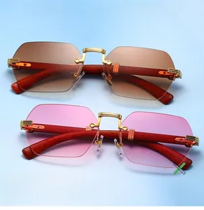Detailed close-up of rimless gradient sunglasses with gold bridges and wood texture temples