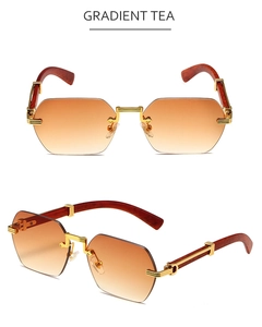 Detail of gradient tea rimless sunglasses with faceted lenses and wooden texture temples