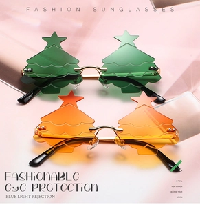 Detail view of stylish Christmas tree shaped sunglasses with wave lenses and gold star