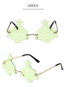 Detail view of green Christmas tree shaped sunglasses with gold metal temples and star top