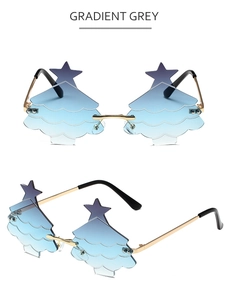 Detail view of rimless Christmas tree shaped sunglasses with gradient lenses and gold metal temples