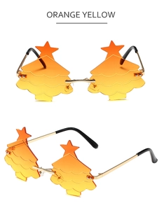 Detail view of orange-yellow gradient Christmas tree glasses with gold metal frame