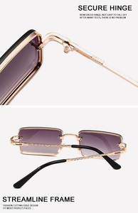 Makroaufnahme einer randlosen Sonnenbrille mit lila Farbverlauf und goldenen Metallscharnieren