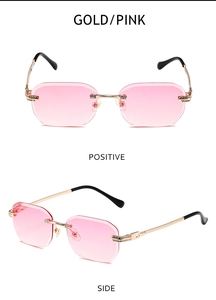 Detail einer randlosen Sonnenbrille mit rosa Verlaufsgläsern und goldenen Metallbügeln