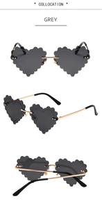 Detailed views of grey heart-shaped rimless sunglasses with gold metal wave edge