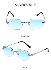 Nahaufnahme der randlosen Sonnenbrille mit blauem Verlauf und gravierten Silberbügeln