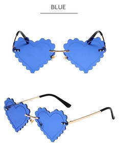 Detail of heart-shaped blue sunglasses with scalloped edges and gold metal frames