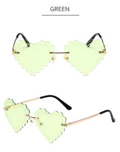 Detail view of heart-shaped green rimmedless sunglasses with unique scalloped edges