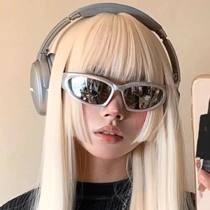 Futuristic silver steampunk sunglasses styled with metallic headphones for a Y2K fashion look