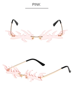 Vue détaillée de lunettes de soleil flamme sans monture roses avec branches en métal doré