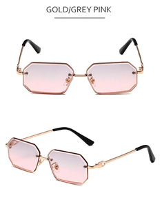 Details einer achteckigen Metallsonnenbrille mit Gold-Finish und pinkfarbenen Gläsern