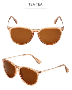 Detail view of vintage aviator sunglasses with tea-colored frames and rose gold metal temples