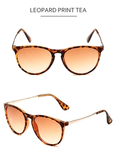 Detailed view of retro leopard print sunglasses with gradient tea lenses and metal temples