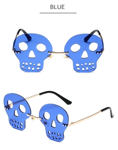 Detail view of blue skull-shaped rimless sunglasses with gold metal frame and nose pads