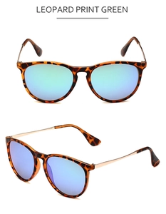 Detail of leopard print sunglasses with blue-green mirrored lenses and gold metal temples