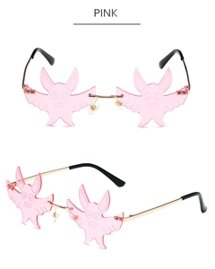 Detail view of pink bat-shaped rimless sunglasses with cartoon texture and metal frame