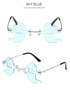 Detail view of sky blue ghost-shaped frameless sunglasses with gold metal temples
