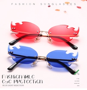 Detail of red and blue flame-shaped rimless sunglasses with gold metal frames