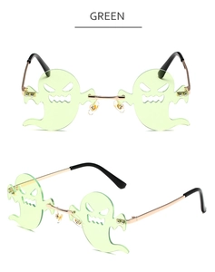 Close-up of green ghost-shaped rimless lenses with gold metal temples and details