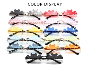 Multi-color display of cool bat-shaped rimless sunglasses for party and street fashion