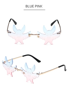 Detail of bat-shaped rimless sunglasses in blue-pink gradient with gold metal frame