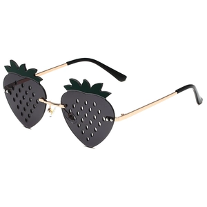 Funny strawberry-shaped sunglasses with green leaf accents and gold metal frame