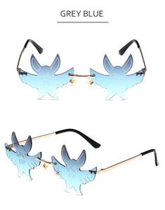 Detail of grey blue bat-shaped frameless sunglasses with gradient lenses and metal frames