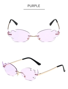 Detail of purple flame-shaped rimless sunglasses with gold metal frame and adjustable pads