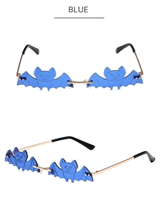 Close-up of blue bat-shaped rimless sunglasses with sleek golden metal temples