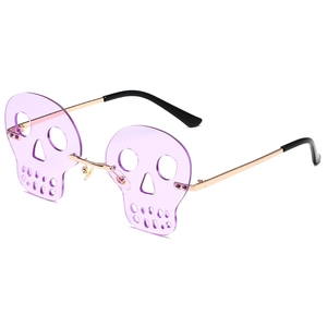 Frameless skull-shaped sunglasses with purple translucent lenses and gold metal frames