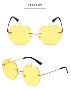 Vues de face et de côté des lunettes de soleil sans monture jaunes en forme de pomme