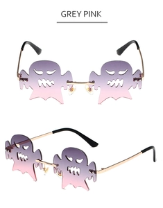 Makroaufnahme einer randlosen Geister-Sonnenbrille in Graurosa mit Gold-Metallrahmen