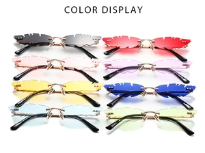 Leaf-shaped rimless sunglasses in eight candy colors with gold metal frames and jagged edges