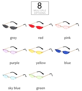 Close-up of 8 leaf-shaped rimless sunglasses in multiple vibrant candy colors with gold metal arms