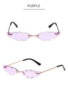 Detail view of purple leaf-shaped rimless sunglasses with gold metal frame