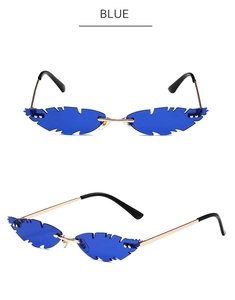 Detail view of blue feather shaped rimless sunglasses with gold metal temples