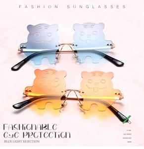 Detailed view of novelty tiger-shaped gradient sunglasses with anti-blue light lenses