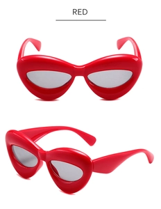 Vues détaillées des lunettes de soleil avant-gardistes rouges aux montures en forme de cœur