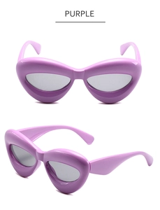 Vue détaillée des lunettes de soleil œil-de-chat mauves avec monture épaisse brillante