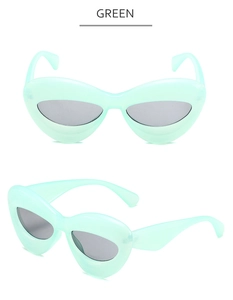 Vue détaillée des lunettes de soleil œil-de-chat vert menthe avec monture épaisse