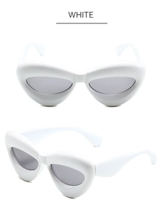 Détail des lunettes de soleil œil de chat blanches en forme de cœur avec monture