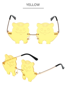 Close-up of yellow cartoon tiger sunglasses with golden metal temples for costume party