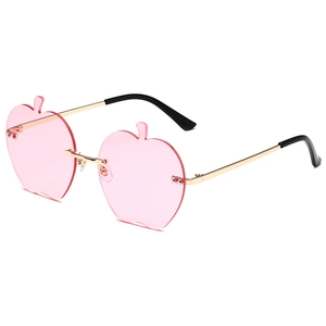 Lunettes de soleil sans monture en forme de pomme avec verres roses et branches en métal doré