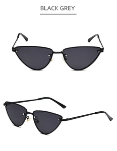 Détails de lunettes de soleil œil de chat en métal noir avec verres gris, vue de profil